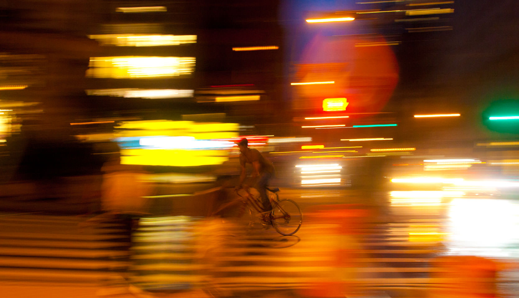 Union Square at Night Photo. Biker in New York City.