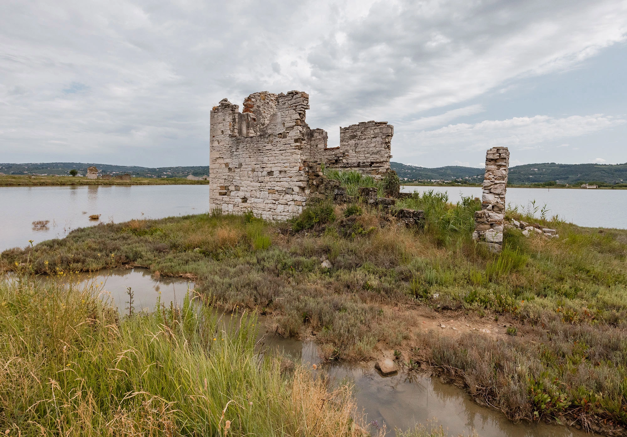 A cloudy day reveals an abandoned pre-Yugoslav salter house at the Sečovlje Salt Pans in Slovenia.