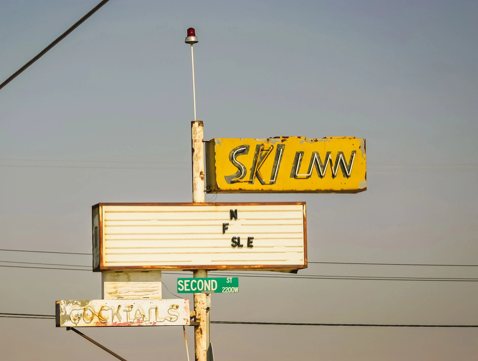 The Ski Inn in Bombay Beach, the only bar on California's Salton Sea, its faded exterior and hand-painted signs capturing the quirky resilience of a community perched on the edge of environmental collapse.